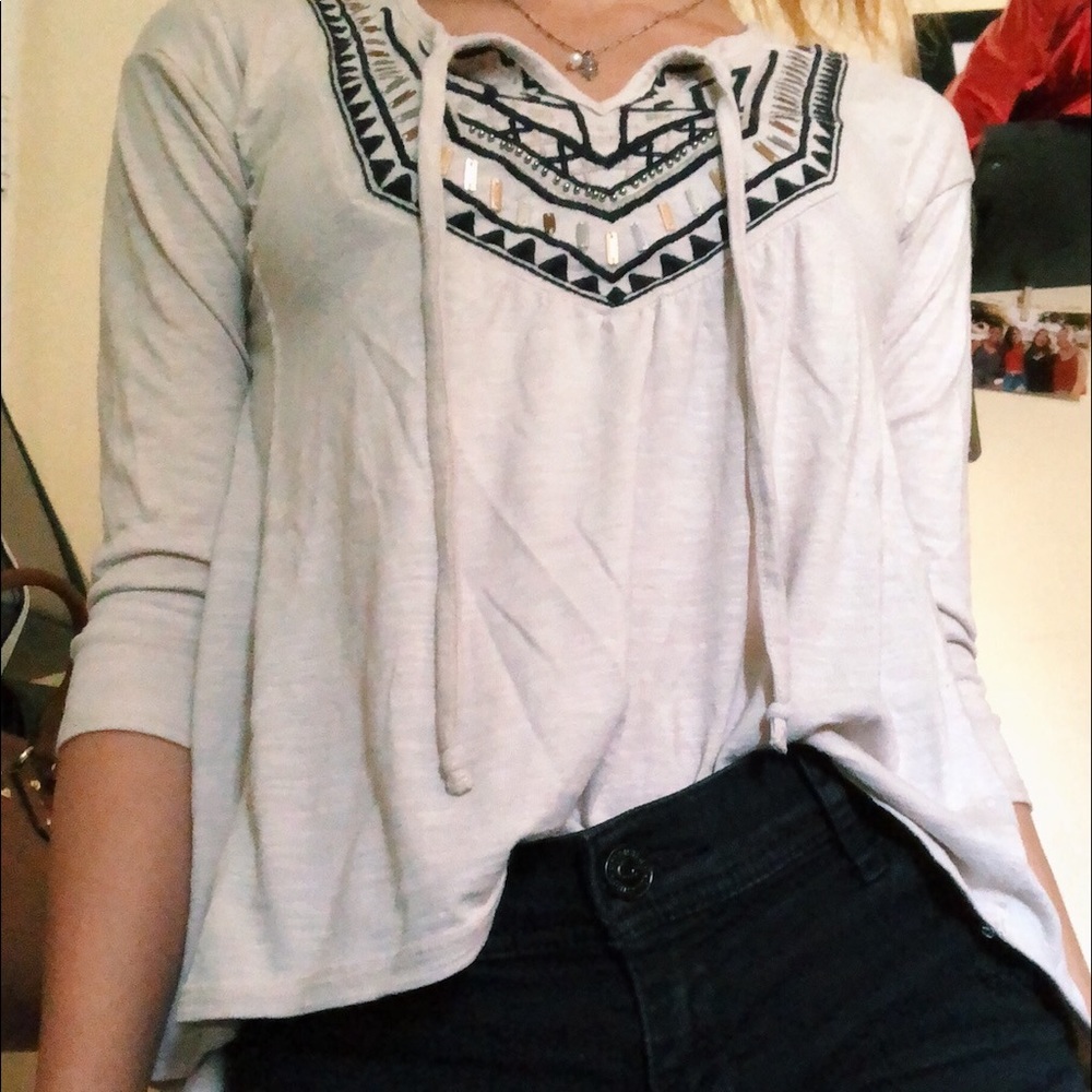 Mid length sleeve top with a design